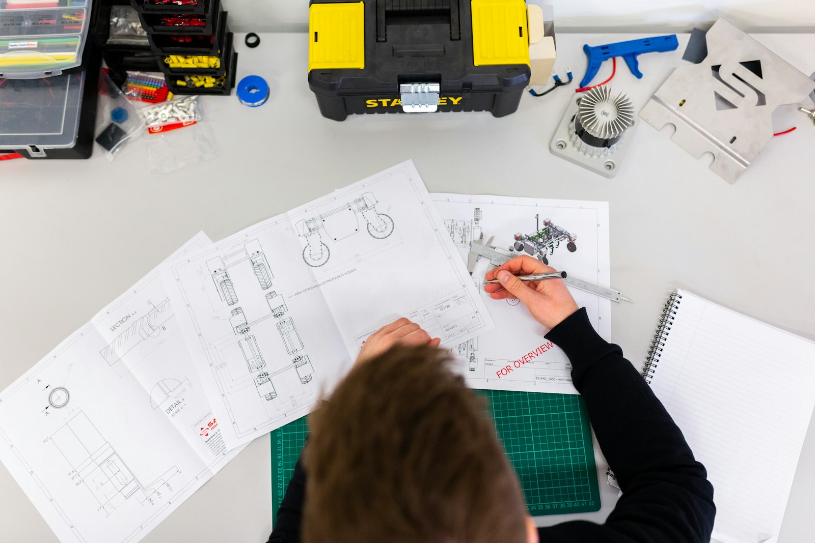 An internal auditor checking work on the factory floor